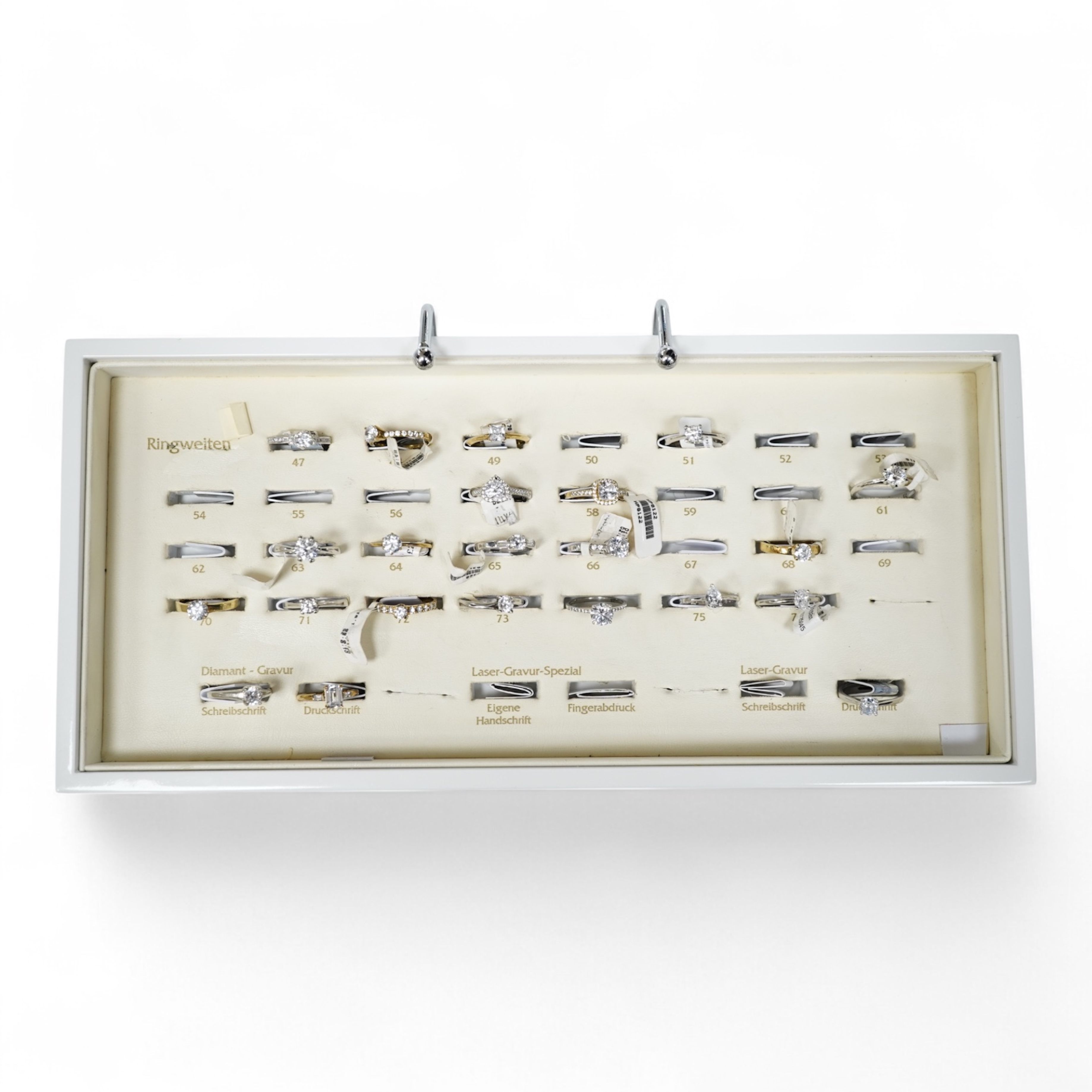 A collection of 22 simulant diamond rings, variously mounted in silver and base metal, one in platinum, British hallmarks, together with a ring display unit